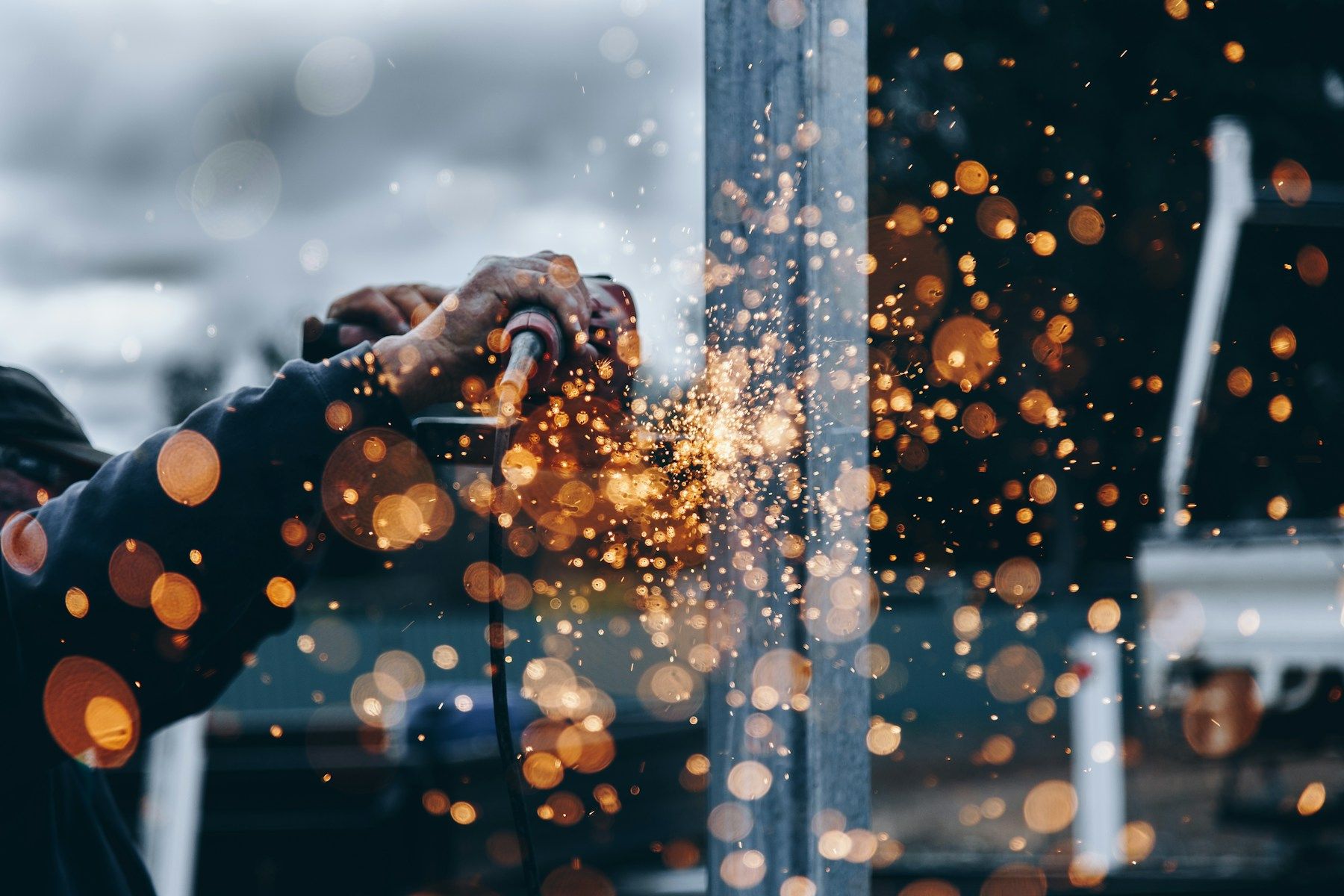 Metal fabrication work with sparks from a cutting tool